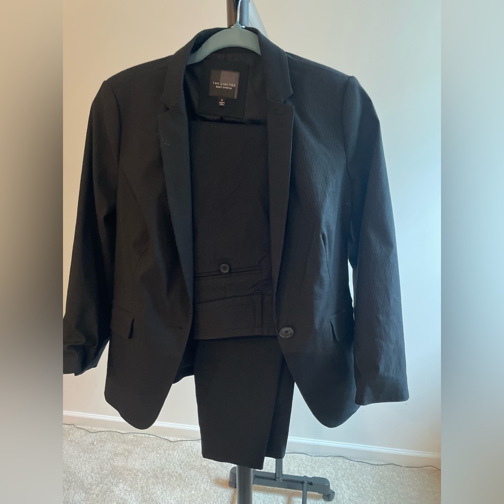 Beautiful business suit black with very light stripes padded shoulders